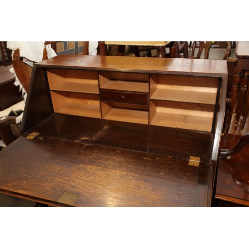 654 - An Arts & Crafts walnut break bowfront double pedestal desk with tooled lined top, fitted seven draw... 