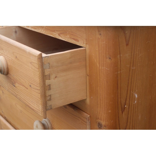 660 - A waxed pine chest of two short and two long drawers with knob handles, 41