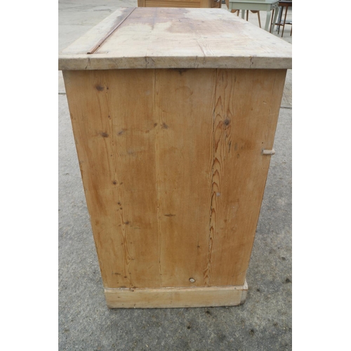 663 - A 19th century waxed pine sideboard/dresser base, fitted two drawers over two cupboards enclosed pan... 