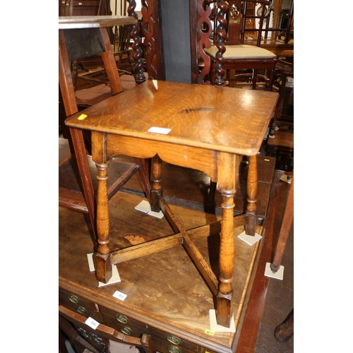 587 - An oak square top occasional table, on turned and stretchered supports, 16