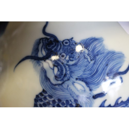 89 - A Chinese porcelain blue and white bottle vase, decorated mythical beasts with four-character mark t... 