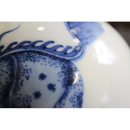 89 - A Chinese porcelain blue and white bottle vase, decorated mythical beasts with four-character mark t... 