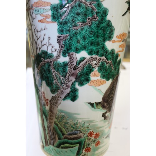 91 - A Chinese famille verte tapered cylindrical waisted flared rim vase with figures, animals and birds ... 