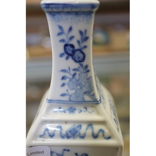 92 - Two Chinese blue and white square-section vases, one decorated with vases and scrolls and the other ... 