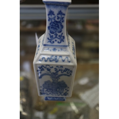 92 - Two Chinese blue and white square-section vases, one decorated with vases and scrolls and the other ... 