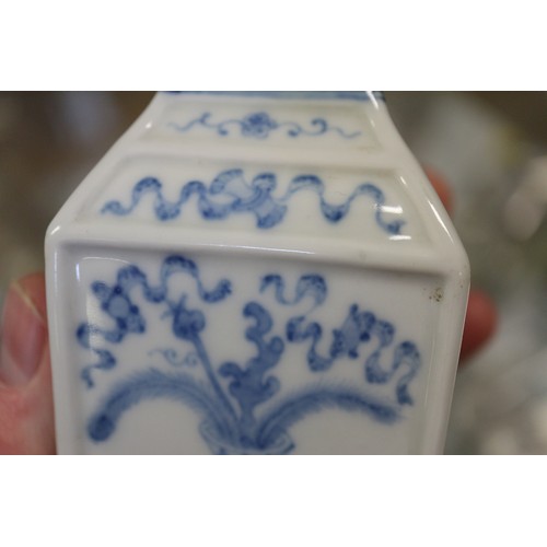 92 - Two Chinese blue and white square-section vases, one decorated with vases and scrolls and the other ... 