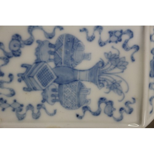 92 - Two Chinese blue and white square-section vases, one decorated with vases and scrolls and the other ... 