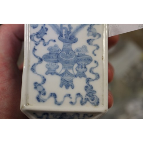 92 - Two Chinese blue and white square-section vases, one decorated with vases and scrolls and the other ... 