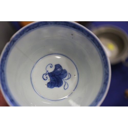 96 - A Chinese porcelain blue and white tea bowl, decorated mythical beasts and clouds with four-characte... 