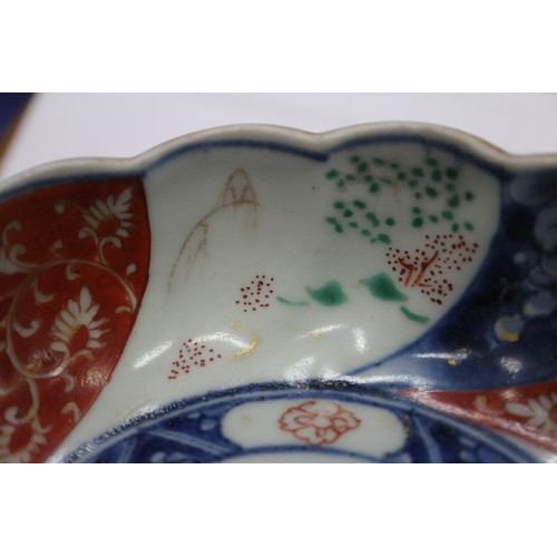 96 - A Chinese porcelain blue and white tea bowl, decorated mythical beasts and clouds with four-characte... 