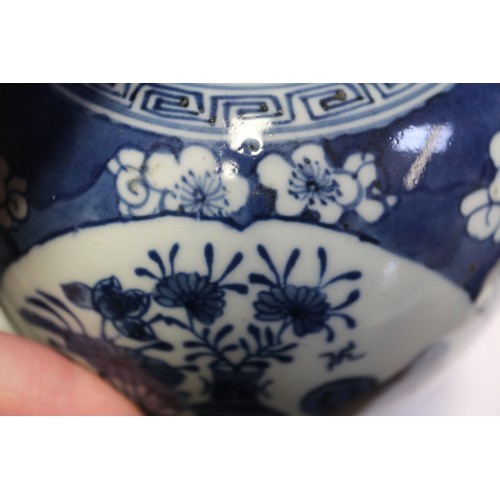 101 - A Chinese blue and white ginger jar, decorated panels with vases, tables and flowers, 5 1/2