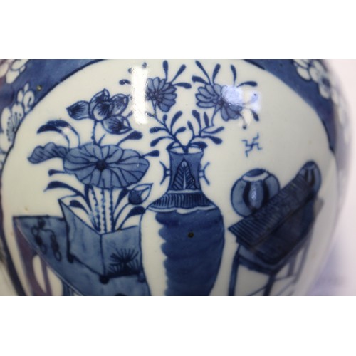 101 - A Chinese blue and white ginger jar, decorated panels with vases, tables and flowers, 5 1/2