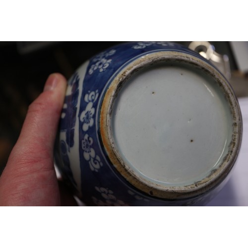 101 - A Chinese blue and white ginger jar, decorated panels with vases, tables and flowers, 5 1/2