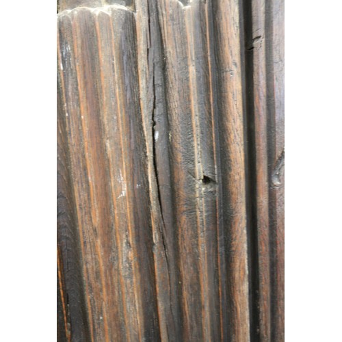 524 - A carved oak wardrobe of 17th century design enclosed linen fold panel door, on stile supports, 40 1... 