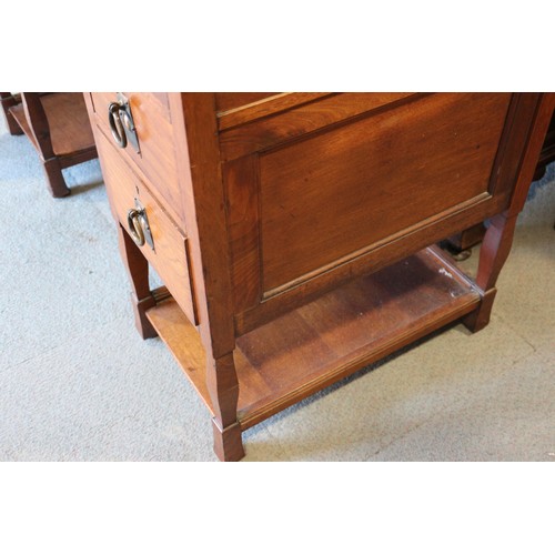 654 - An Arts & Crafts walnut break bowfront double pedestal desk with tooled lined top, fitted seven draw... 