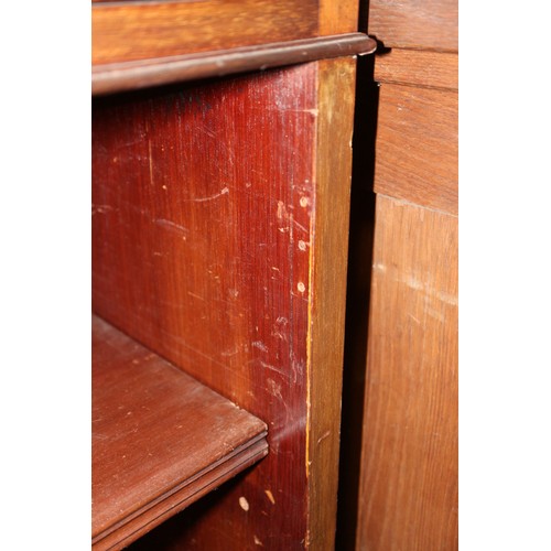 561 - A Maples late 19th century walnut book case, fitted two drawers over open shelves, on bracket feet, ... 