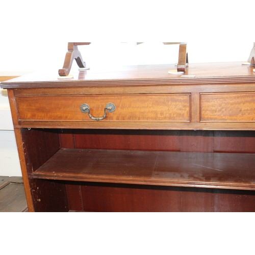 561 - A Maples late 19th century walnut book case, fitted two drawers over open shelves, on bracket feet, ... 