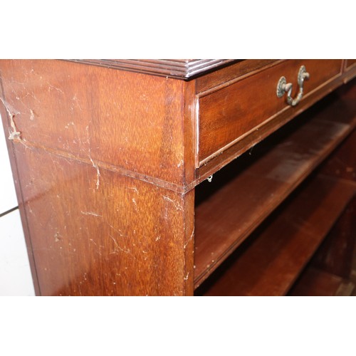 561 - A Maples late 19th century walnut book case, fitted two drawers over open shelves, on bracket feet, ... 