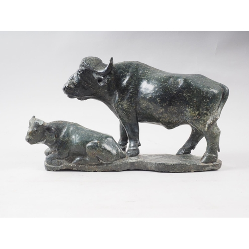 300 - Z F Runyanga: a carved greenstone model of a water buffalo and calf, 14