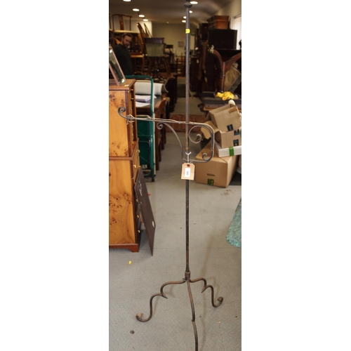 316 - A wrought iron standard lamp, on tripod splay supports, 63 1/2