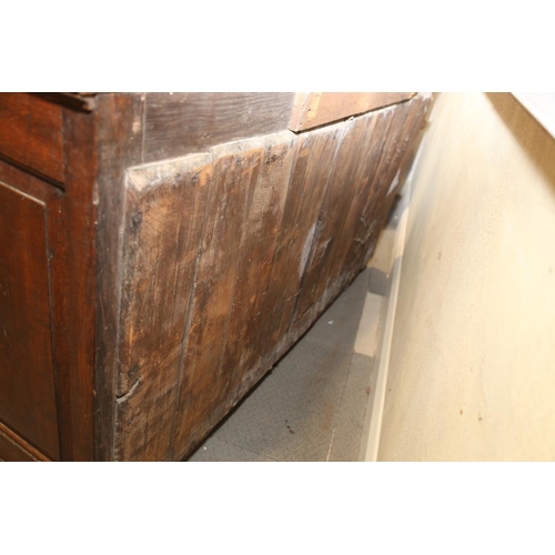 566 - A George III oak dresser, fitted shelves over three drawers and two cupboards enclosed arched panel ... 