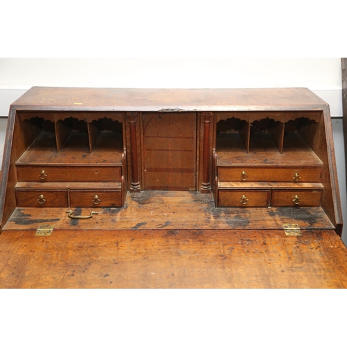 571 - A Georgian oak and mahogany banded fall front bureau, fitted interior with drawers and pigeonholes o... 