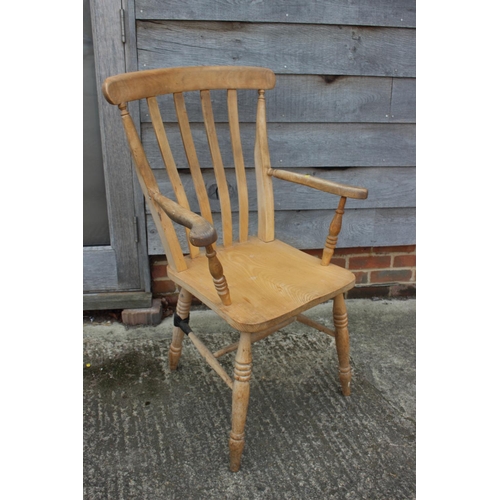 645 - A beech Windsor lath back farmhouse elbow chair (damages)