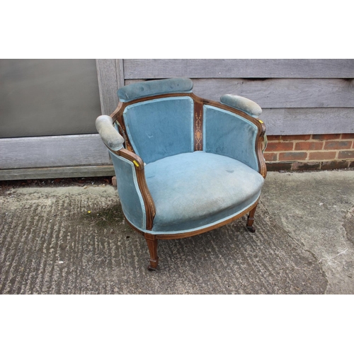 646 - An Edwardian rosewood and inlaid tub-shape chair, upholstered in a blue velour, on square taper supp... 