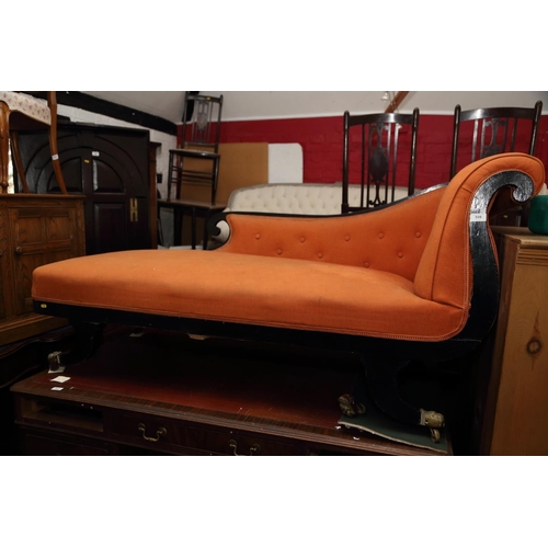 647 - An early 20th century ebonised frame chaise longue, on turned supports