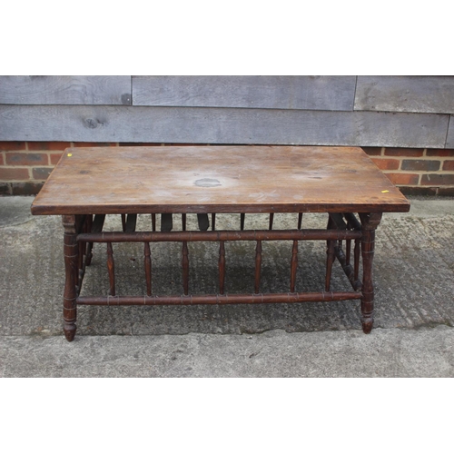 649 - An Arts & Crafts elm and ash low occasional table with spindle sides and turned supports, 42 1/2