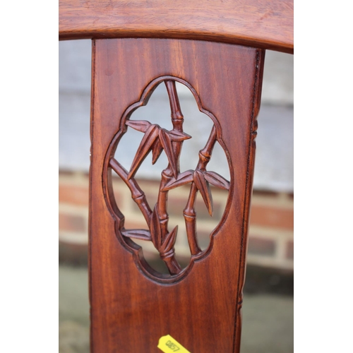 650 - A Chinese hardwood circular dining table, fitted four frieze drawers, on faux bamboo cluster column,... 