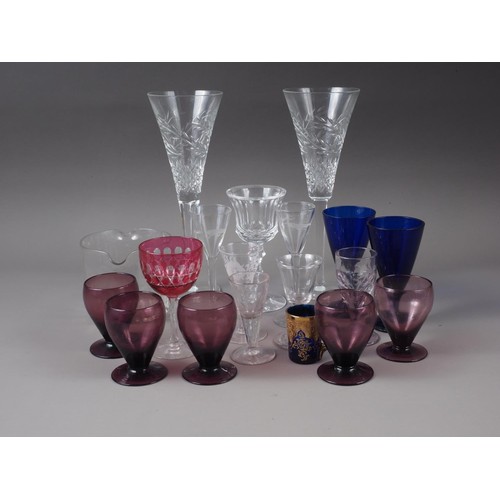 83 - A triple ring necked decanter, six other decanters, a jug, two similar vases and a pair of cut glass... 