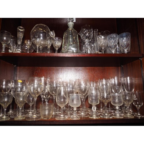 83 - A triple ring necked decanter, six other decanters, a jug, two similar vases and a pair of cut glass... 