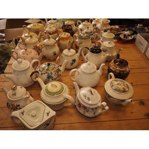 102 - A collection of twenty-eight contemporary china teapots, including Royal Cauldon 