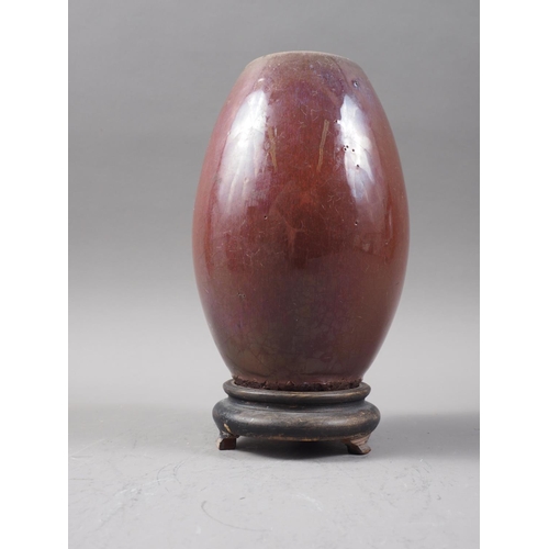 136 - A Chinese flambe glazed barrel-shaped vase, 6 1/2