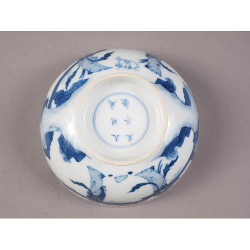 139 - A Chinese blue and white bowl, decorated figures in a landscape, six-character mark to base, 6