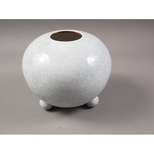 148 - A Chinese bulbous crackle glazed vase, on three bun feet, 6 1/4