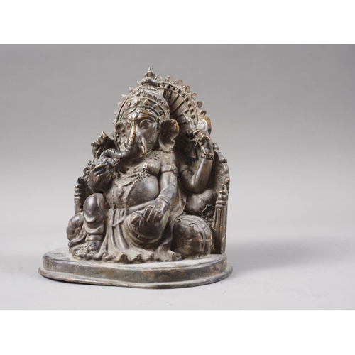 165 - An Indian patinated brass  figure of a Ganesh, 5 3/4