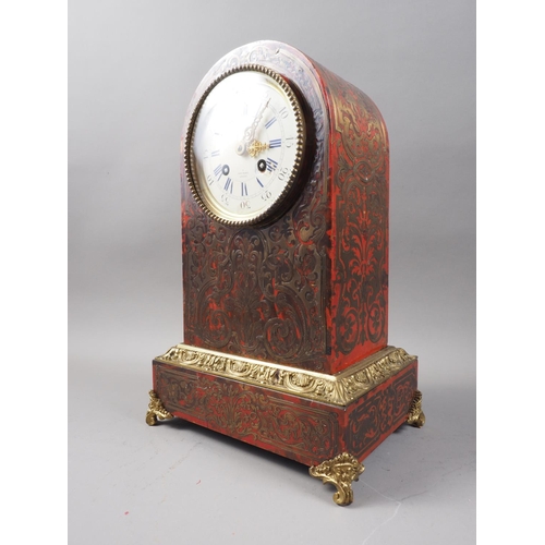 179 - A 19th century red tortoiseshell and brass boulle work arch top mantel clock with enamelled dial and... 