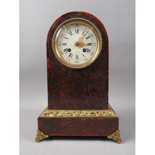 179 - A 19th century red tortoiseshell and brass boulle work arch top mantel clock with enamelled dial and... 