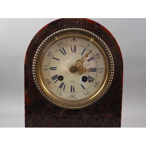 179 - A 19th century red tortoiseshell and brass boulle work arch top mantel clock with enamelled dial and... 