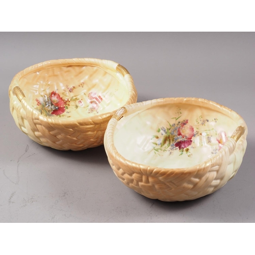 19 - Two early 20th century Royal Worcester blush ivory baskets with floral decoration, 8 3/4