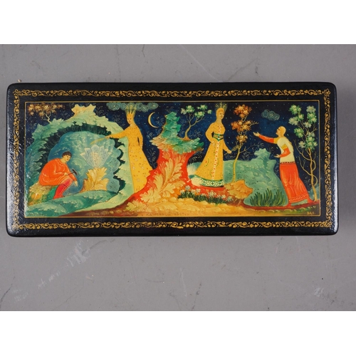 206 - A Russian Palekh papier-mache box, the lid decorated winter scene, and another similar