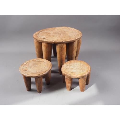 212 - Three mid 20th century Nigerian hardwood (iroko) Nupe stools, collected in 1950s in Abuja, largest 1... 