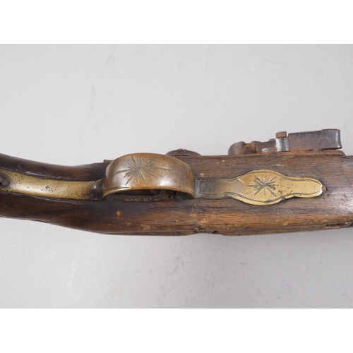 251 - A 19th century Continental flintlock pistol with embossed barrel, 16