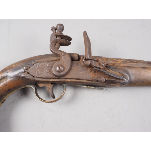 251 - A 19th century Continental flintlock pistol with embossed barrel, 16