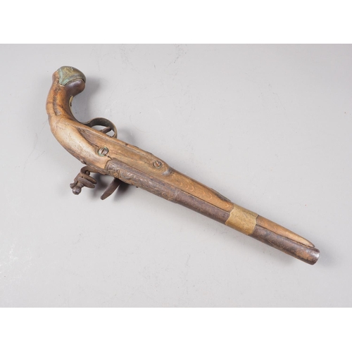 251 - A 19th century Continental flintlock pistol with embossed barrel, 16