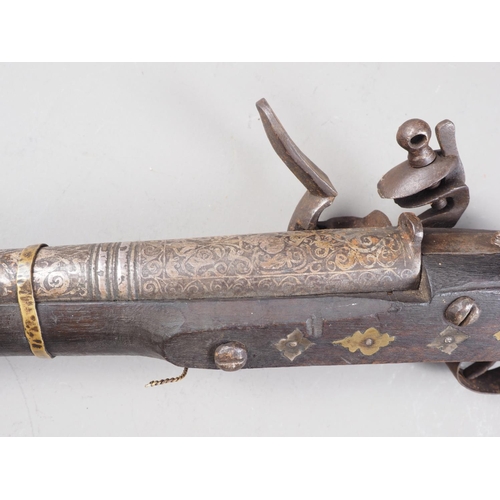 254 - A Jezail flintlock musket with scroll etched barrel, 44 3/4