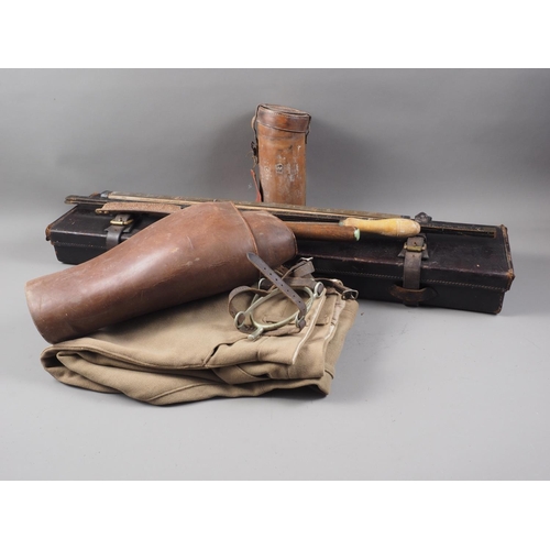 260 - A pair of leather gaiters, a pair of khaki jodhpurs, a leather stirrup cup holder, a leather shotgun... 