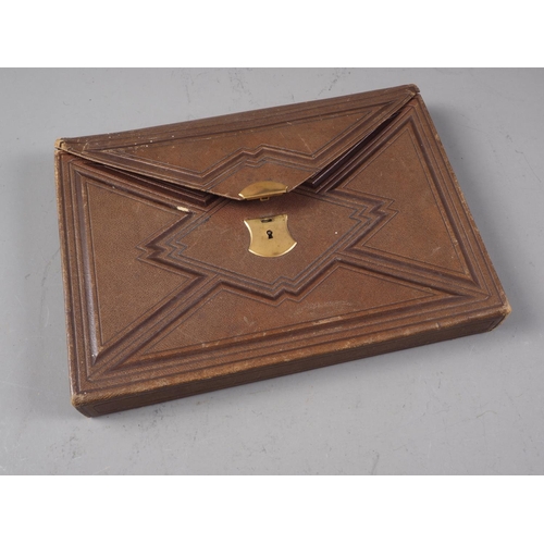 267 - A mid 19th century leather writing wallet with part fitted interior, 10 1/4